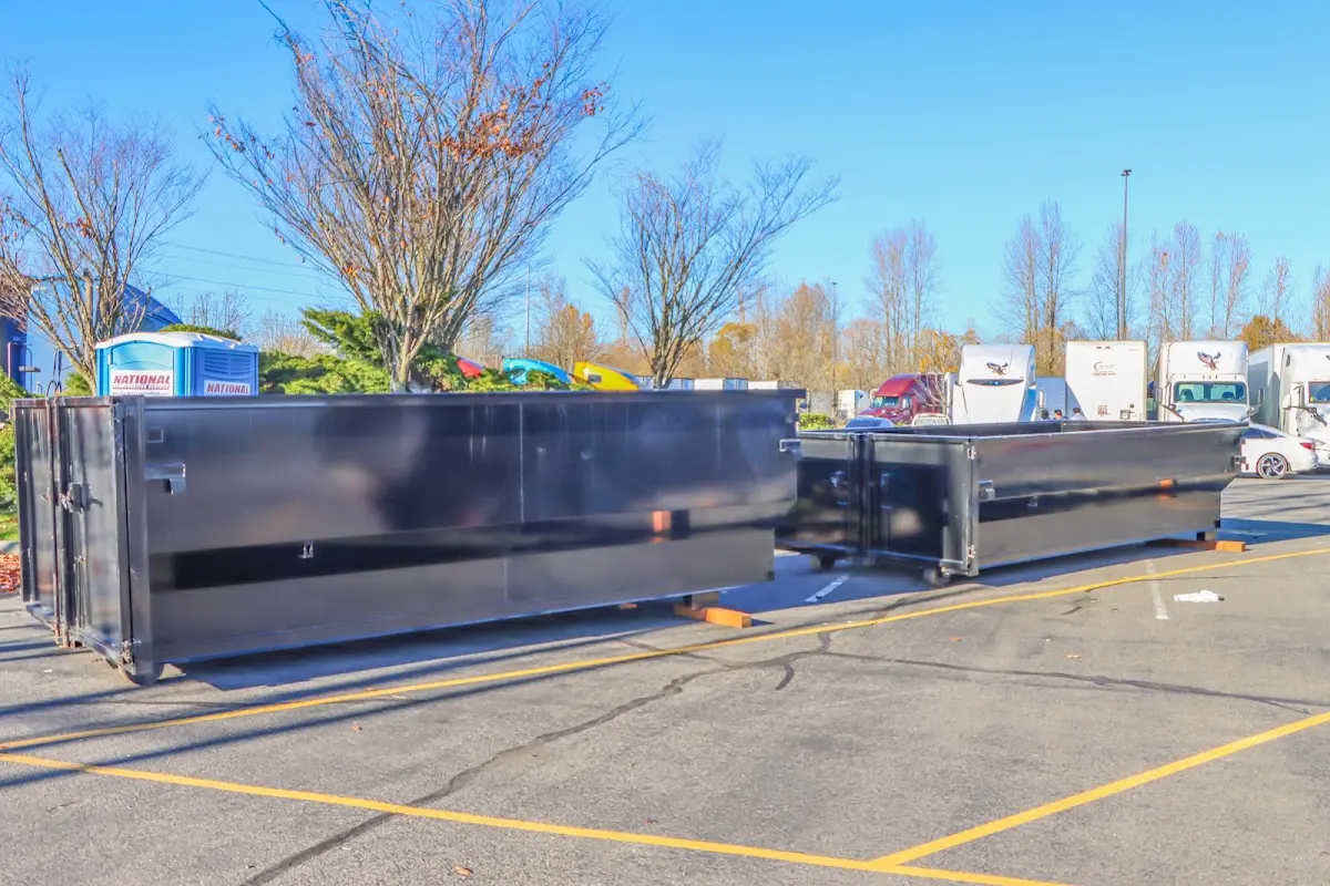 Professional dumpster rental service with roll-off container on residential driveway in Fairview Shores